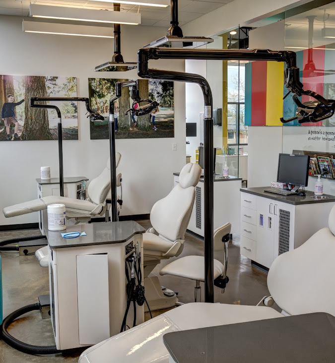 Modern dental clinic interior with equipment and chairs